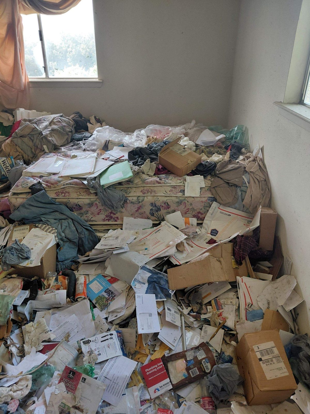 Room in as-is condition before clean-out at 1203 Rossolis Dr